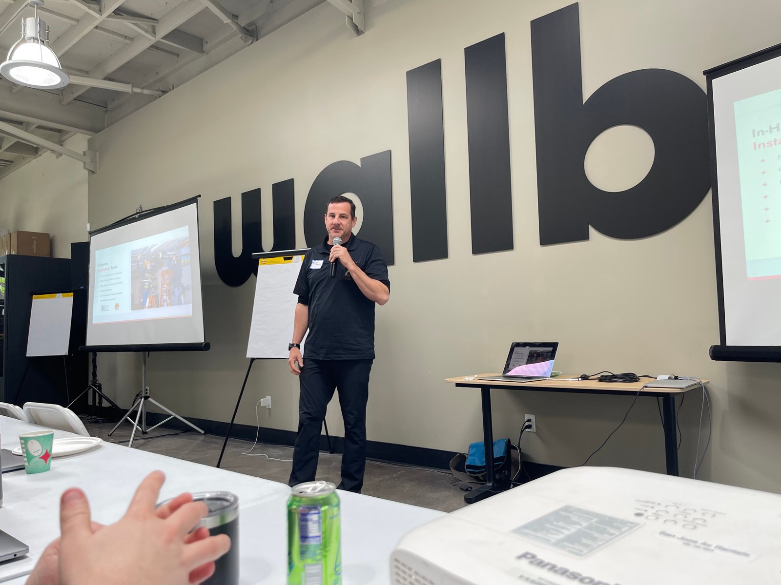 Mike speaking into a microphone during an industry presentation